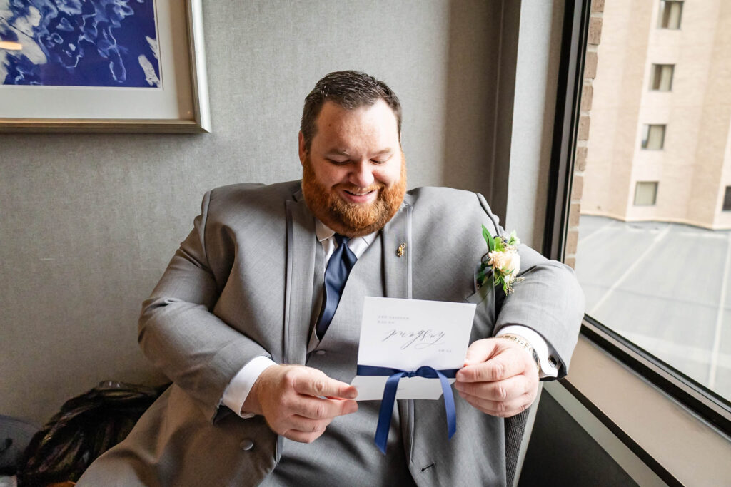 Groom Mike Richardson preparing in Savvi Formalwear for Basilica wedding ceremony