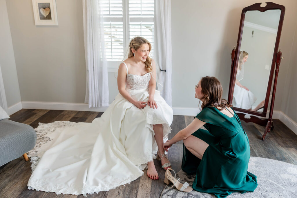 Bride Jillian Baker getting ready at Piazza Messina in Cottleville MO with White Traditions gown