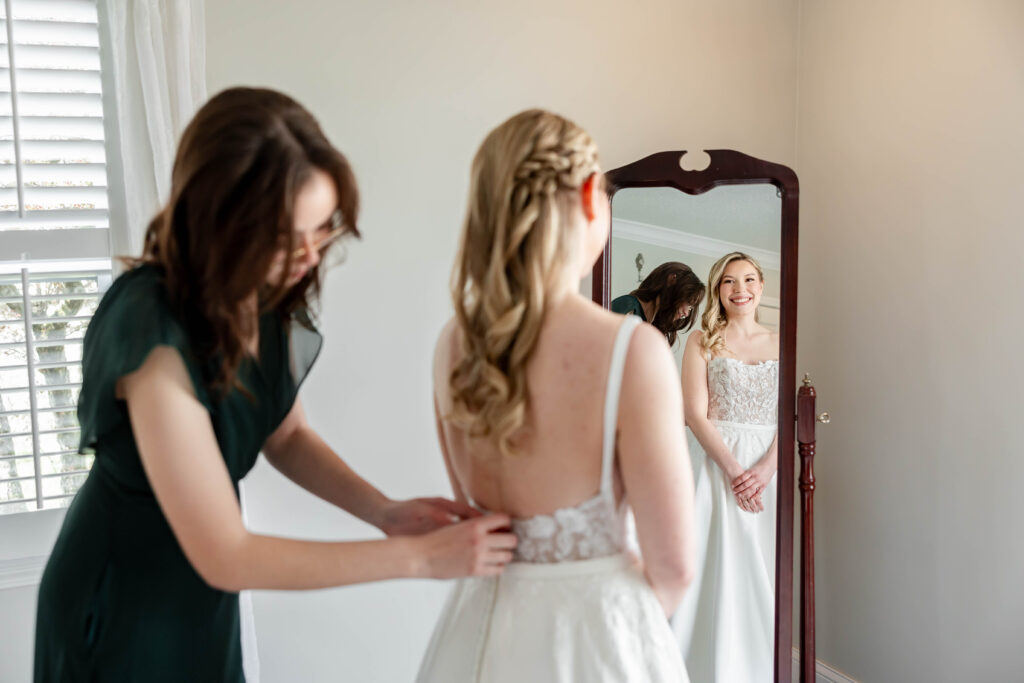 Bride Jillian Baker getting ready at Piazza Messina in Cottleville MO with White Traditions gown