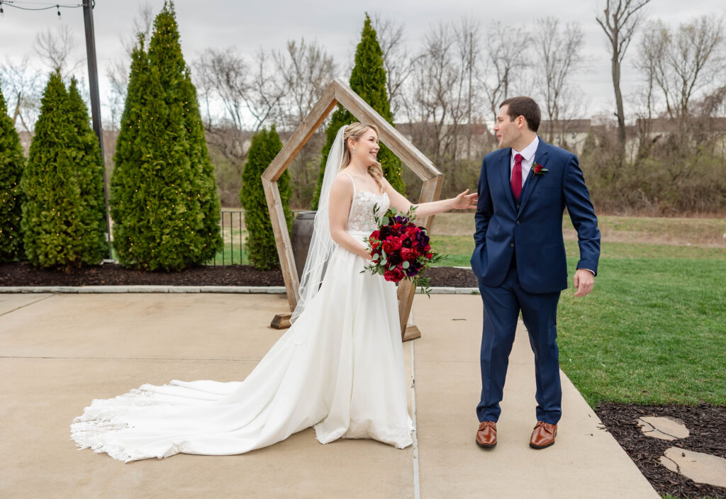 First look between bride and groom at Piazza Messina by St. Louis wedding photographer