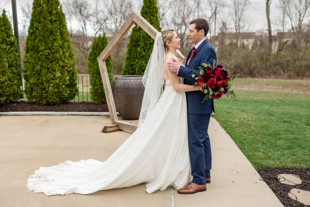 First look between bride and groom at Piazza Messina by St. Louis wedding photographer