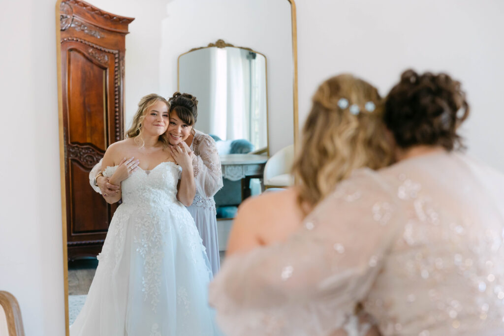 Bride Kenzie Jones getting ready at Silver Oaks Chateau in Pacific MO in Two Sparrows gown