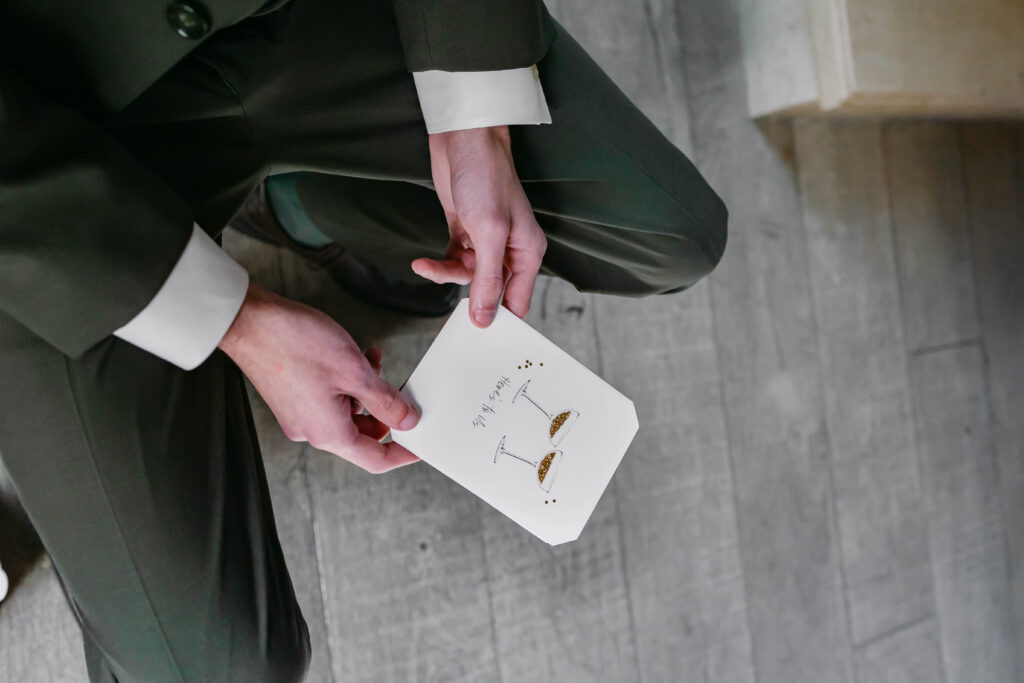 Kenzie and Tyler reading letters to each other before ceremony at Silver Oaks Chateau